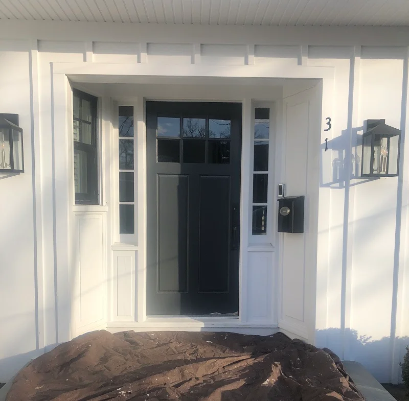 Wood front door with sidelights needing replacement in Scarsdale, NY